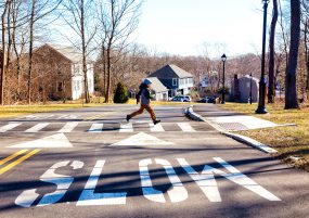 Child running on crosswalk child running on crosswalk